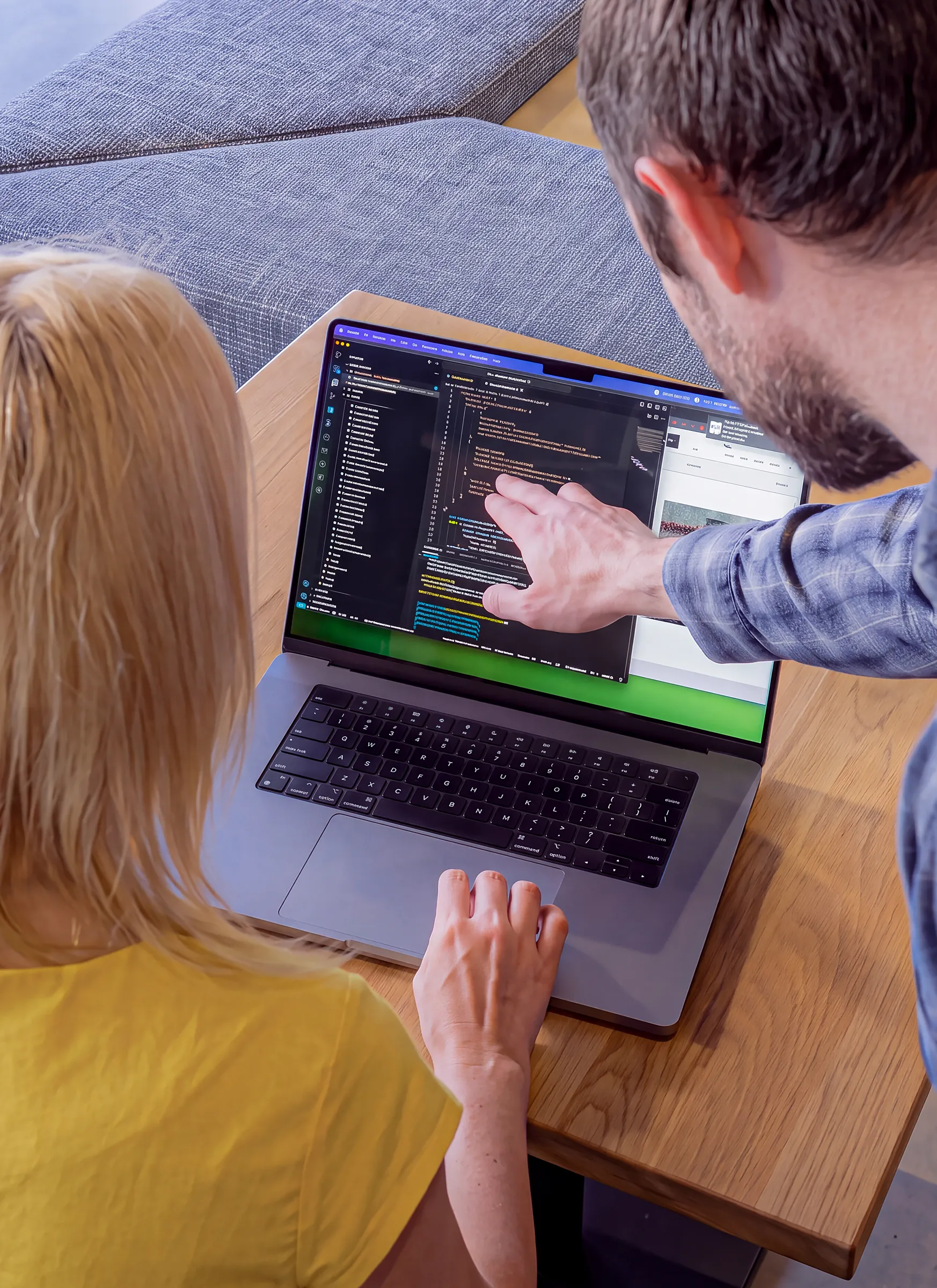Arctic Leaf developers reviewing code together on a laptop